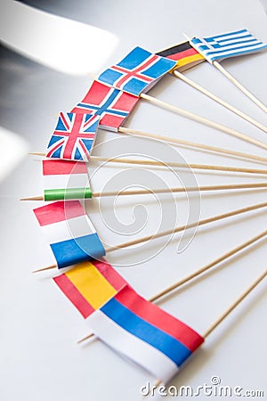 Bunch of miniature paper flags of several countries: Greece,Germany,Sweden,Norway,England,Italy,France,Spain, Russia Stock Photo