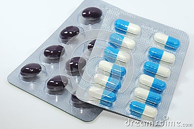 A bunch of pills and a bunch of capsules Stock Photo