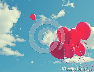 Bunch of red ballons on a blue sky Stock Photo