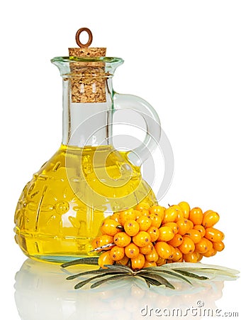 Bunch sea buckthorn berries and oil bottle isolated on white. Stock Photo