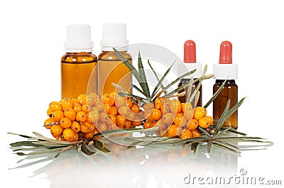 Bunch sea buckthorn oil and bubbles out it isolated. Stock Photo