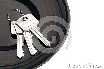 Bunch of three keys in black saucer Stock Photo
