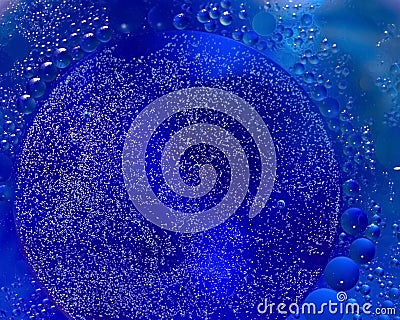Bunch of tiny bubbles inside sphere made from blue water surreal abstract wallpaper macro Stock Photo
