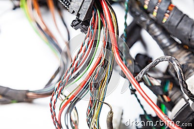 Bunch of twisted wires of different colors and sizes with rewound electrical tape and connectors. Remote work for programmers, SMS Stock Photo