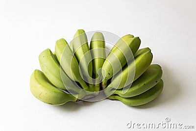 Bunches of green, underripe baby bananas fanned out Stock Photo