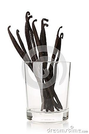 Bundle of dried bourbon vanilla beans or pods in glass over white Stock Photo