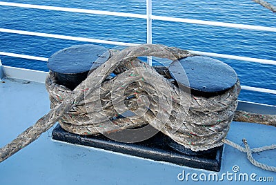 Bundle of marine ropes on the mooring bollard Stock Photo