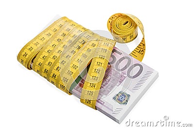 Bundle of money rewound measuring tape Stock Photo