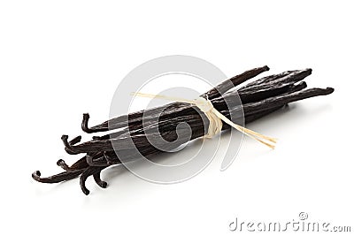 Bundle of tied, dried bourbon vanilla beans or pods over white Stock Photo