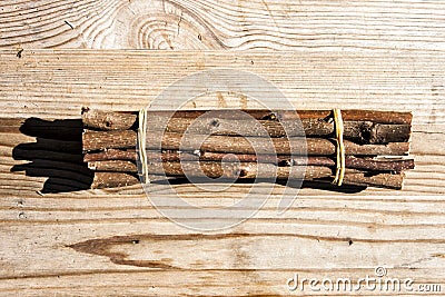 Bundle twigs on wooden table Stock Photo