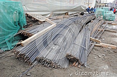 Bundles of long steel reinforcement on the building site Editorial Stock Photo