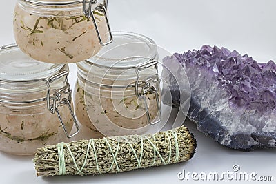 Bundles of Sage with amethyst and jars of beauty product Stock Photo