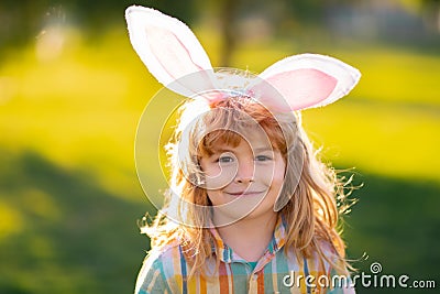 Bunny child boy face. Child boy in rabbit costume with bunny ears in park. Stock Photo