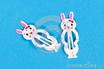 Bunny hairclips isolated on a blue background Stock Photo