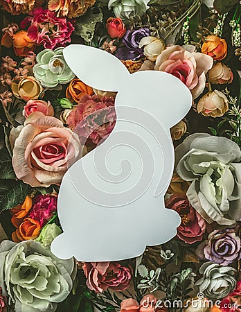 Bunny shape made of colorful flowers; Top view, flat lay; Creative minimal spring or Easter background Stock Photo