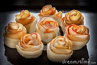 Buns-rosettes on a baking sheet, oiled. Bakery products Stock Photo