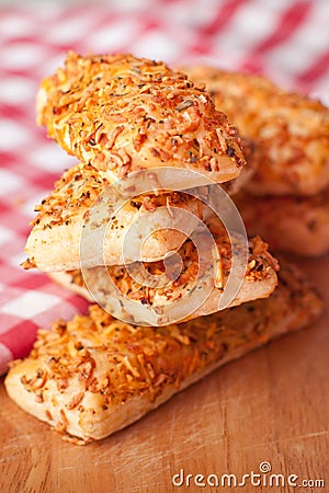Buns sprinkled with grated cheese and spices Stock Photo