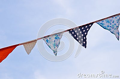 A bunting of colorful burgees flittering in the wind Stock Photo