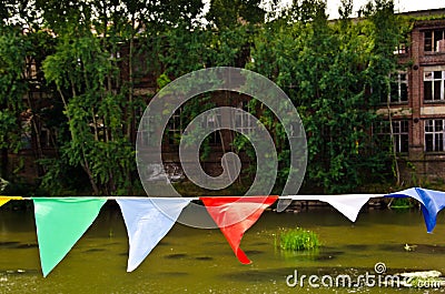 A bunting of colorful burgees flittering in the wind Stock Photo