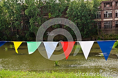 A bunting of colorful burgees flittering in the wind Stock Photo