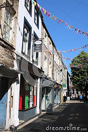 Bunting and shop fronts, New Street, Lancaster Editorial Stock Photo