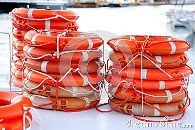 Buoys round lifesaver stacked for boat safety Stock Photo