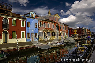 Burano island canal, colorful houses and boats, Venice Italy Europe Editorial Stock Photo