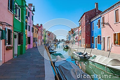 Burano island water canal, colorful houses and boats, Venice, Italy Editorial Stock Photo