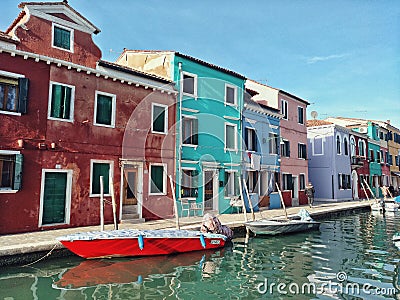 Burano, Italy - February 2019: Lovely canal view with colorful houses in Burano, Italy Editorial Stock Photo