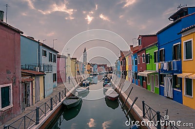 Burano street with colorful houses and water channel with boats Editorial Stock Photo