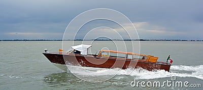 Water taxi with tourists sails along the Grand Cana Editorial Stock Photo