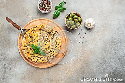 burek meat pie with tomatoes and olives on a wooden board. Balkan pie, Concept of Turkish cuisine, Stock Photo