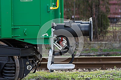 Burgas, Bulgaria - March 20, 2017 - Freight cargo train Buffer- 4axled box wagon green Type:Eanos Model:155-1 - Transvagon AD Stock Photo