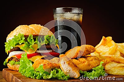 Burger, chicken nuggets, french fries and cola drink Stock Photo