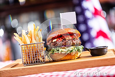 Burger with empty food flag and french fries in american restaurant Stock Photo