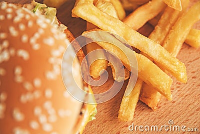 Burger and French fries on a wooden Board the view from the top Stock Photo