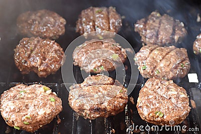 Burgers cooking on the grill Stock Photo