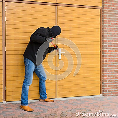 Burglar with a crowbar Stock Photo