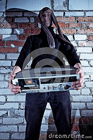 Burglar stealing electronics Stock Photo