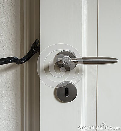 Burglar trying to break into a house Stock Photo