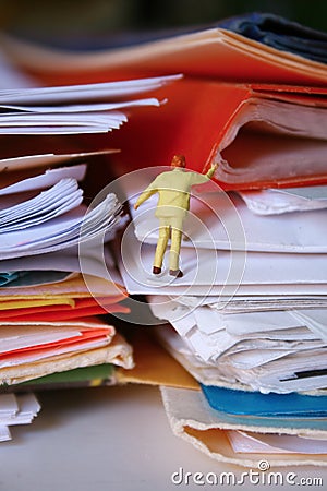 Buried under paper work Stock Photo