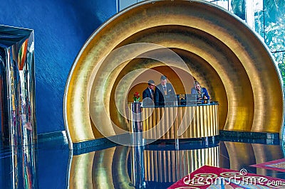 Burj al-Arab Hotel,reception desk and hall in Dubai, UAE. Editorial Stock Photo