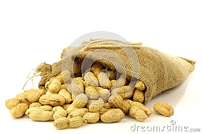 Burlap bag with roasted peanuts Stock Photo