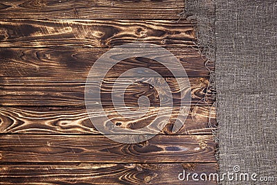 Burlap on dark wooden background Stock Photo