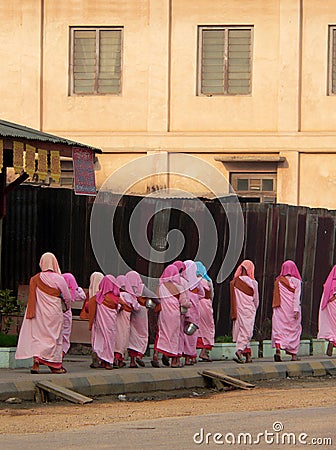 Burma. Nuns Alms Collecting Stock Photo