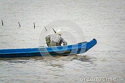 Burmese fisherman netting fish in a river near Yangon 3 Editorial Stock Photo