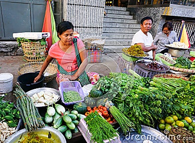 Burmese women selling fresh fruits at Bogyoke market Editorial Stock Photo