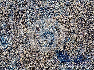 Burn places in old worn carpet. Damaged cover Stock Photo