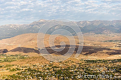 Burn scar from wildfire stretches across the landscape hwy 395 south of Reno, NV Stock Photo