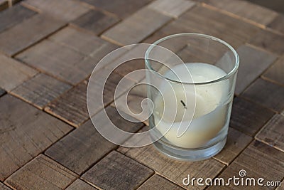 Burned candle decoration on couch table Stock Photo